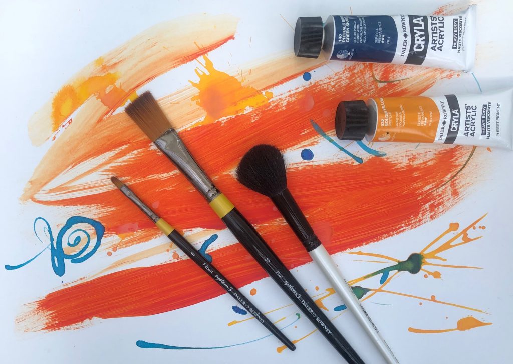 online art classes bright orange paint paint brushes acrylic paint