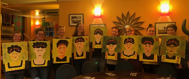 paint night group smiling with Frida Kahlo paintings with chrissie richards
