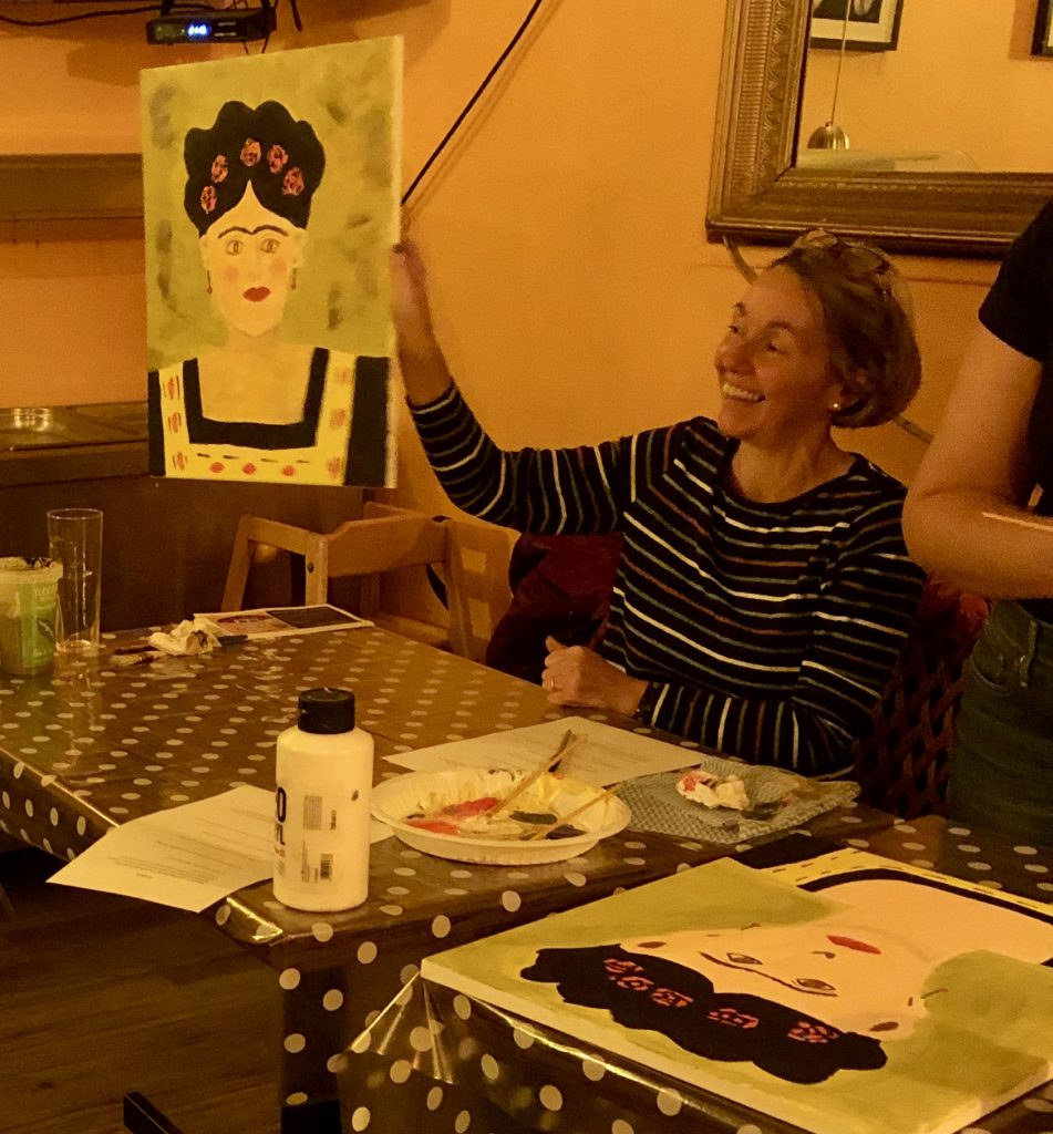 lady showing her Frida Kahlo painting at paint night with Chrissie Richards