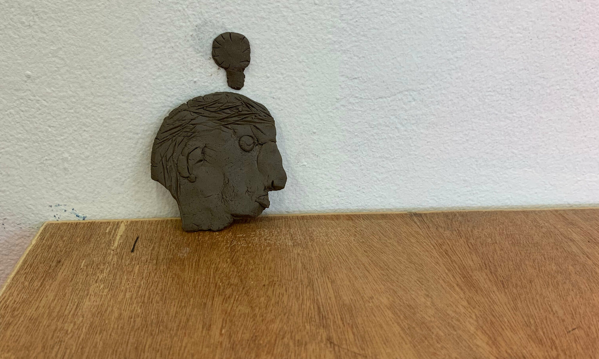 clay head on desk