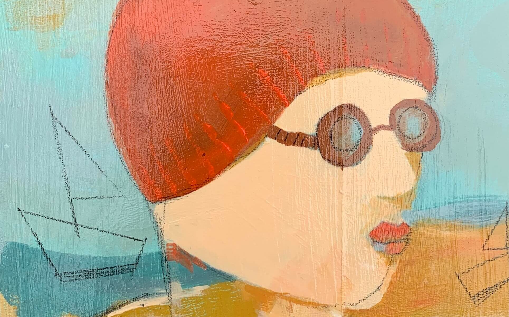 swimmer in red bobble hat and quirky glasses