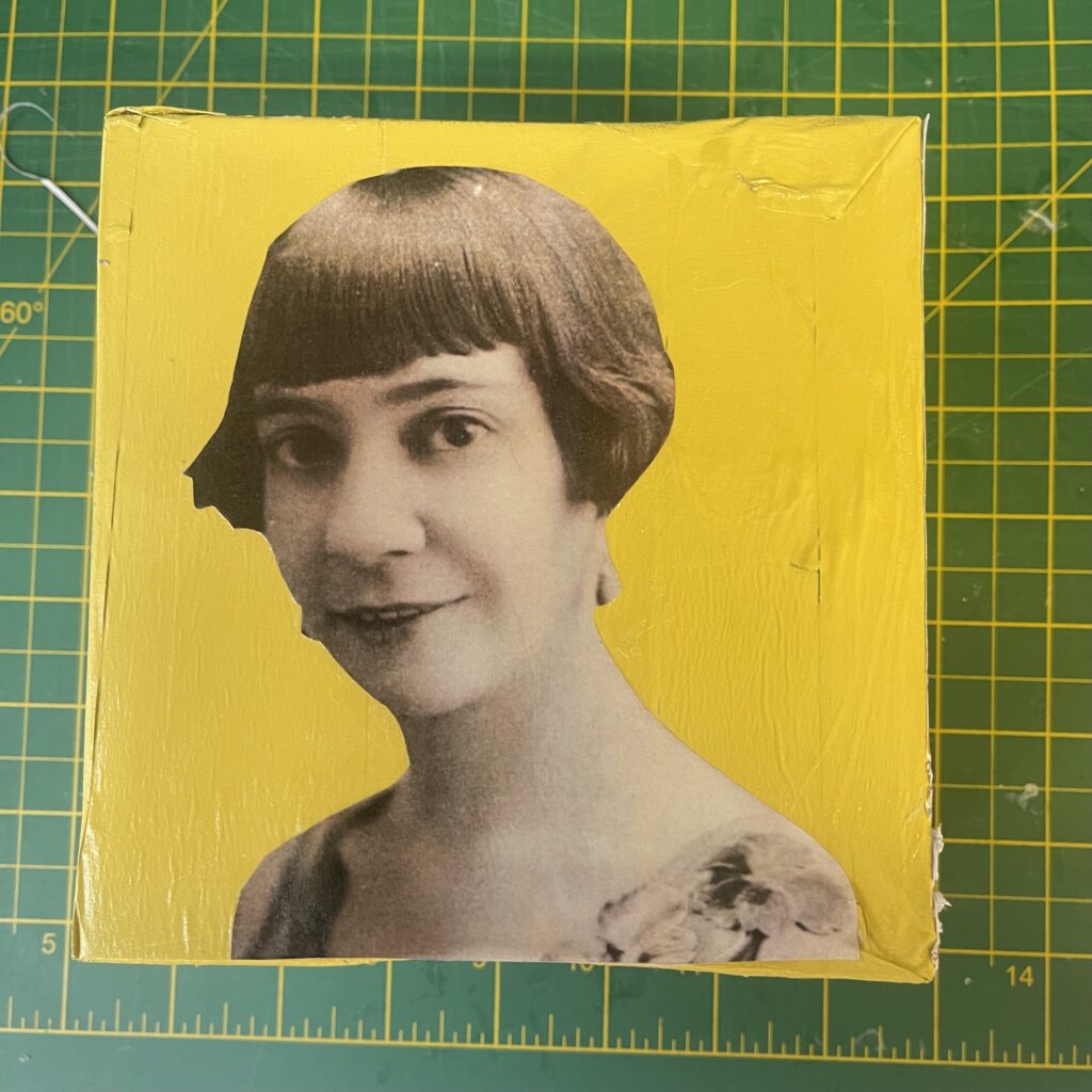 black and white image of woman on a yellow background