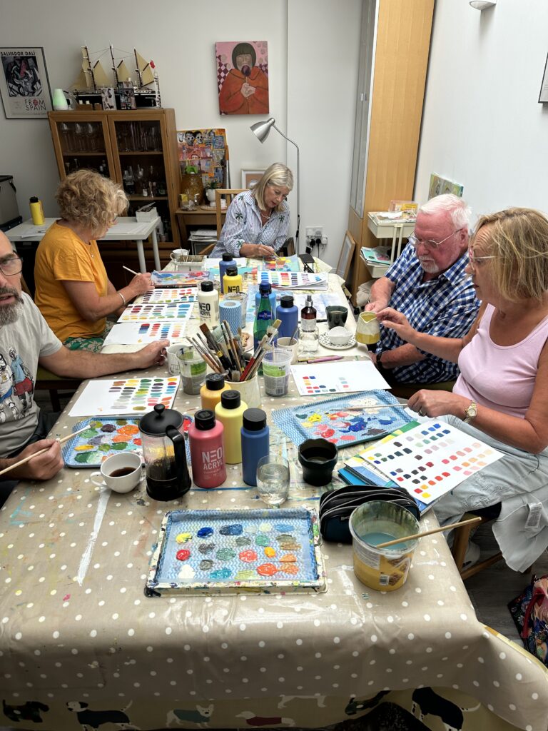 art club in progress lots of colour